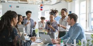 Diverse team collaborating in a bright modern workspace.